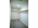 Walk-in closet with neutral carpet, overhead light and shelving at 2761 Frosted Teal Ave, North Las Vegas, NV 89086