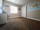 Comfortable bedroom with large window, plush carpet, and ample natural light at 2840 China Cove St, Laughlin, NV 89029