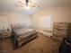 Serene main bedroom with neutral decor, ample natural light, and carpeted floors at 2840 China Cove St, Laughlin, NV 89029