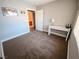Inviting bedroom with plush carpet and desk, perfect for study or work at 2840 China Cove St, Laughlin, NV 89029