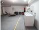Spacious garage featuring washer, dryer and some fitness equipment at 2840 China Cove St, Laughlin, NV 89029