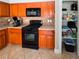 Well-equipped kitchen with modern appliances, wooden cabinets, and a convenient pantry at 2840 China Cove St, Laughlin, NV 89029