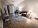 Comfortable living room with wood flooring, a cozy rug, and plenty of natural light at 2840 China Cove St, Laughlin, NV 89029