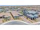 Aerial view of a desert community with a single story home and brick paver driveway at 2910 Monate Ct, Henderson, NV 89044