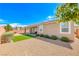Relaxing backyard showcases a covered patio, gravel, and low maintenance landscaping at 2910 Monate Ct, Henderson, NV 89044