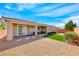 The backyard features desert landscaping, a patio, and a small patch of grass at 2910 Monate Ct, Henderson, NV 89044