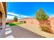 Private backyard features a covered patio, gravel, and xeriscaping at 2910 Monate Ct, Henderson, NV 89044