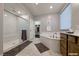 Well-lit bathroom featuring a soaking tub and a separate glass shower at 2910 Monate Ct, Henderson, NV 89044