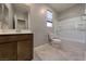Bathroom with vanity, toilet, and shower-tub combo, providing a functional space at 2910 Monate Ct, Henderson, NV 89044