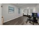 Comfortable bedroom with wood floors, lots of light, and modern gaming setup at 2910 Monate Ct, Henderson, NV 89044