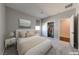 Bedroom with a neutral palette, plush carpeting, and a view of an organized closet at 2910 Monate Ct, Henderson, NV 89044