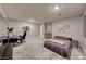 Spacious bedroom with neutral carpet, gaming setup, and ample lighting at 2910 Monate Ct, Henderson, NV 89044