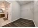 Walk-in closet with hardwood floors and white wire shelving for optimal organization at 2910 Monate Ct, Henderson, NV 89044