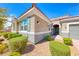 Close up of a charming single story home featuring desert landscaping and stone accents at 2910 Monate Ct, Henderson, NV 89044