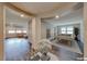 View of a living and game room with wood floors, pool table, and neutral wall colors at 2910 Monate Ct, Henderson, NV 89044