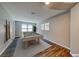 Spacious game room featuring wood floors, natural light, and a rustic pool table at 2910 Monate Ct, Henderson, NV 89044