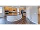 Spacious kitchen features an oversized island, stainless steel appliances, and wood cabinets and floors at 2910 Monate Ct, Henderson, NV 89044