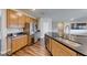 Gourmet kitchen with stainless steel appliances, wood cabinets, granite counters and large island at 2910 Monate Ct, Henderson, NV 89044