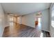 Spacious living room with hardwood flooring, grey walls and lots of natural light at 2910 Monate Ct, Henderson, NV 89044