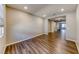 Spacious living room showcasing recessed lighting and stylish wood-look flooring at 2910 Monate Ct, Henderson, NV 89044