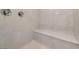 Contemporary shower featuring marble wall accents and a built-in bench at 2910 Monate Ct, Henderson, NV 89044