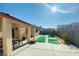 The backyard has an outdoor living space and sport court at 3301 W Colton Ave, North Las Vegas, NV 89032