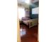 Bright and inviting bedroom with natural light, hardwood floors, and cozy decor at 3301 W Colton Ave, North Las Vegas, NV 89032