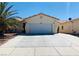 Charming single-story home with a well-maintained front yard and a wide driveway at 3301 W Colton Ave, North Las Vegas, NV 89032