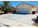 Exterior view of home showcasing well maintained driveway and simple landscaping at 3301 W Colton Ave, North Las Vegas, NV 89032