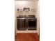 Well-organized laundry room with modern washer and dryer, and shelving at 3301 W Colton Ave, North Las Vegas, NV 89032
