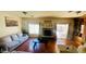 Comfortable living room with large windows, fireplace, and neutral-colored furniture at 3301 W Colton Ave, North Las Vegas, NV 89032