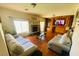 Inviting living area featuring a fireplace, wood floors, and a large decorative cabinet at 3301 W Colton Ave, North Las Vegas, NV 89032