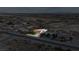 This aerial view showcases the property's large lot size and proximity to surrounding desert landscape at 3481 Winery Rd, Pahrump, NV 89048