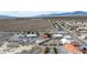 This aerial view shows the home's location among a neighborhood bordering the open desert landscape at 3481 Winery Rd, Pahrump, NV 89048
