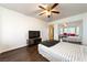 Spacious bedroom with wood floors, a ceiling fan, and a mirrored closet at 3481 Winery Rd, Pahrump, NV 89048