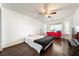 Large bedroom featuring wood floors, natural light, and a ceiling fan at 3481 Winery Rd, Pahrump, NV 89048