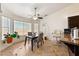 Bright dining area featuring large windows, a ceiling fan and tile flooring at 3481 Winery Rd, Pahrump, NV 89048