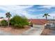 Spacious home featuring a tile roof, desert landscaping, and a long driveway leading to a two-car garage at 3481 Winery Rd, Pahrump, NV 89048