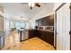Open kitchen featuring stainless steel appliances, granite counters and adjacent dining area at 3481 Winery Rd, Pahrump, NV 89048