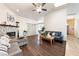 Open living room with vaulted ceilings, wood floors, a cozy sectional sofa, and inviting decor at 3481 Winery Rd, Pahrump, NV 89048
