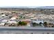 Charming single-story home with mature trees, set against a backdrop of desert landscape and distant mountains at 3481 Winery Rd, Pahrump, NV 89048