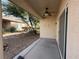Backyard covered patio, with exterior fan and desert landscaping at 3508 Kittiwake Rd, North Las Vegas, NV 89084