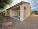 Backyard patio area with covered porch and desert landscaping at 3508 Kittiwake Rd, North Las Vegas, NV 89084