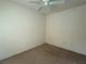 Bedroom with neutral carpet, ceiling fan, and minimalist design at 3508 Kittiwake Rd, North Las Vegas, NV 89084