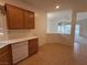 Bright kitchen features tile flooring, white countertops, and wood cabinets with a dishwasher at 3508 Kittiwake Rd, North Las Vegas, NV 89084