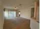 Open living room area featuring carpet, ceiling fan, and access to the backyard through sliding glass doors at 3508 Kittiwake Rd, North Las Vegas, NV 89084