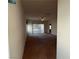 Open living room featuring carpet, tile flooring, ceiling fan, and sliding glass doors at 3508 Kittiwake Rd, North Las Vegas, NV 89084
