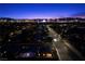 Nighttime aerial shot featuring a quiet neighborhood and the vibrant Las Vegas cityscape at 3706 Etendre Ct, Las Vegas, NV 89121