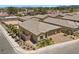 Single-Gathering home featuring a three-car garage and a well-maintained yard with palm trees and desert landscaping at 3706 Etendre Ct, Las Vegas, NV 89121
