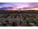 Charming neighborhood view from above with the brilliant Las Vegas skyline as a scenic backdrop at sunset at 3706 Etendre Ct, Las Vegas, NV 89121